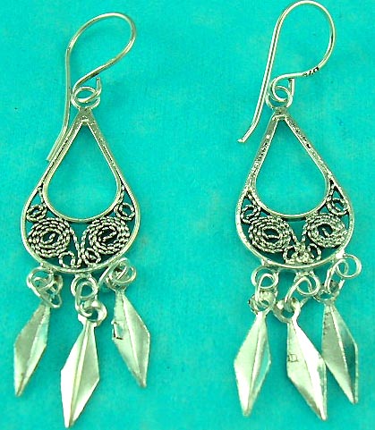jewelry display case presents sterling silver earring with curved and sparkling decoration. 